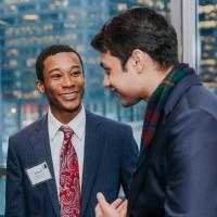 Saad Ahsan'21, Garrett Moore'20, 和 Beth Burnson'88 chat during Beloit's 2019 Econ Day in Chicago.